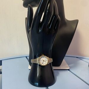 Timex Indiglo Women’s Two-Tone Stretch Band Watch WR 30M Date Gold/Silver Tone